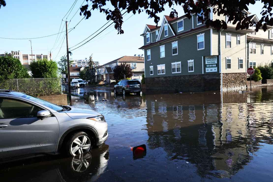 A car left behind in the floodwaters of Passaic, New Jersey. 