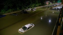 TOPSHOT - Floodwater surrounds vehicles following heavy rain on an expressway in Brooklyn, New York early on September 2, 2021, as flash flooding and record-breaking rainfall brought by the remnants of Storm Ida swept through the area. (Photo by Ed JONES / AFP) (Photo by ED JONES/AFP via Getty Images)