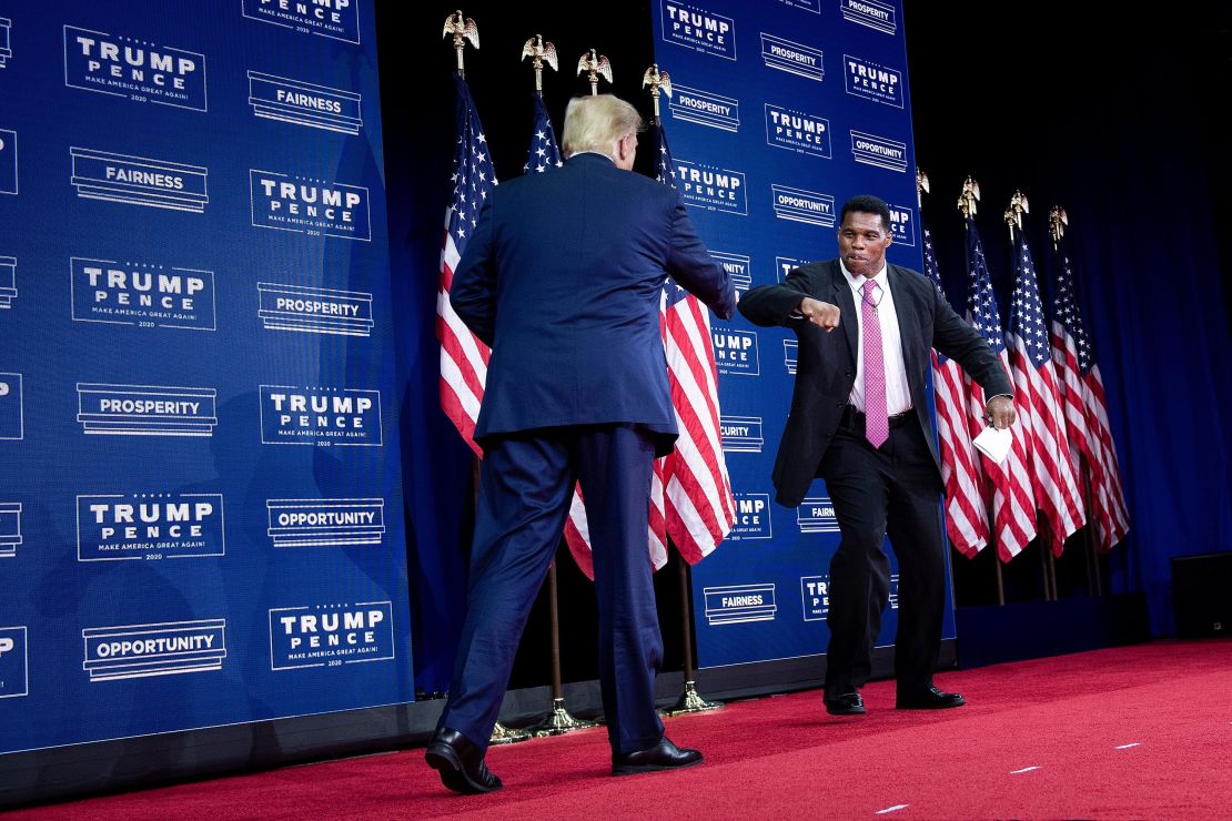 President Donald Trump is greeted by Herschel Walker at an event in Atlanta, Georgia, on September 25, 2020.