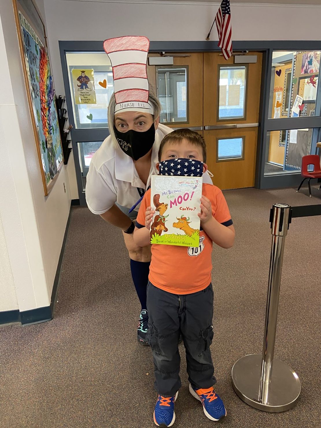 Liz Pray, a school nurse, smiles with her nephew