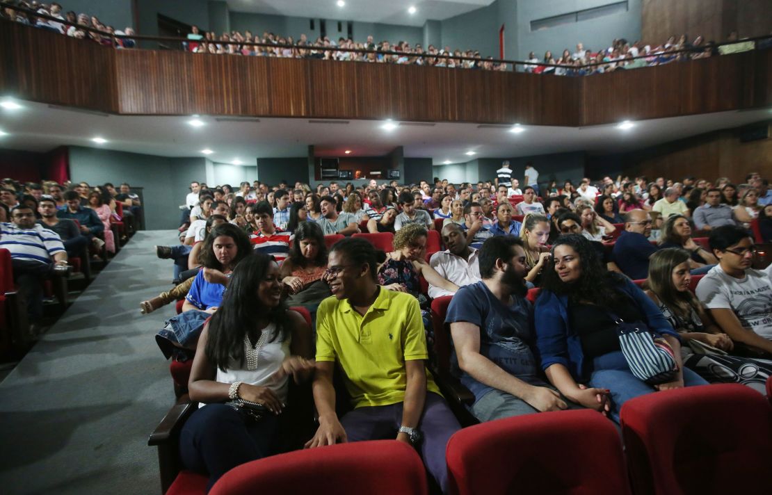 People attend a theatrical performance on April 18, 2015, in Salvador, Brazil.  