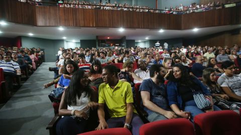 People attend a theatrical performance on April 18, 2015, in Salvador, Brazil.