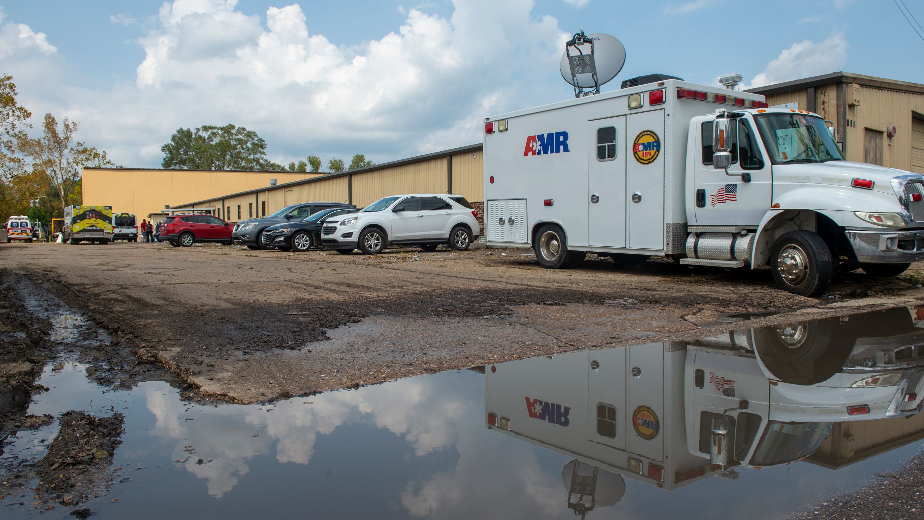 Emergency vehicles respond to evacuate people at a shelter in Independence, Louisiana, on Thursday.