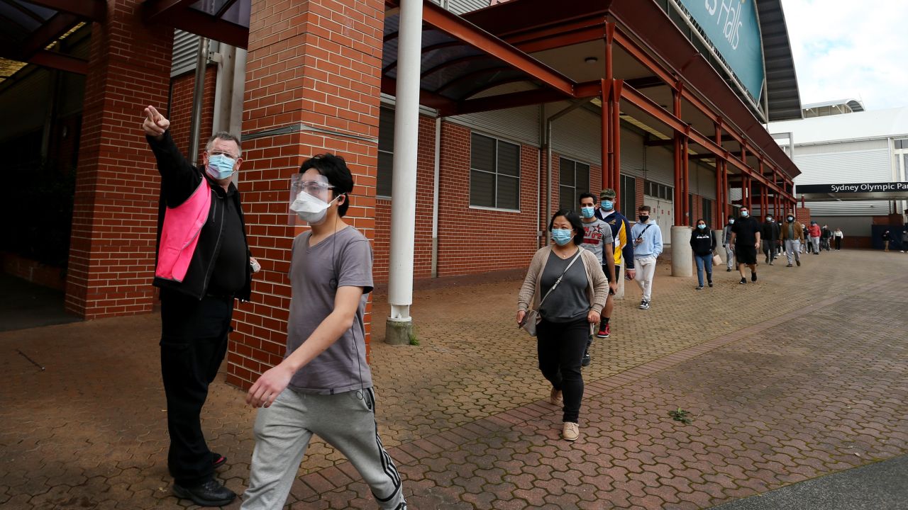 People arriving at Sydney's Qudos Bank Arena NSW Health Vaccination Centre on August 27, 2021. 