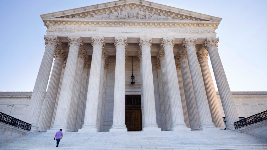 WASHINGTON, DC - SEPTEMBER 02: A person walks on the steps of the U.S. Supreme Court on September 02, 2021 in Washington, DC. The Supreme Court voted 5-4 not to stop a Texas law that prohibits most abortions after six weeks of pregnancy. (Photo by Kevin Dietsch/Getty Images)