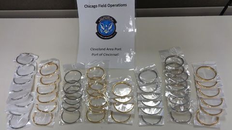 Customs officers seize counterfeit jewelry.