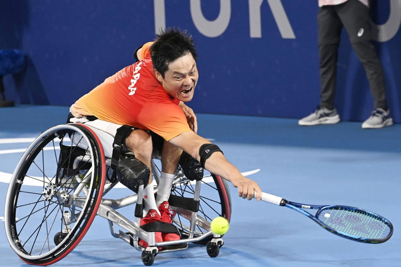 Japan's Shingo Kunieda reaches for a shot during a wheelchair tennis semifinal on September 2. He defeated Great Britain's Gordon Reid.