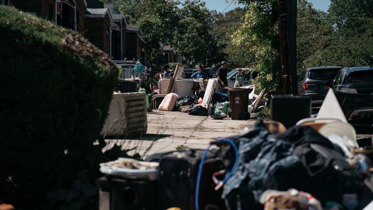 Residents sort through damaged and destroyed items in the Flushing neighborhood of the Queens borough of New York City.