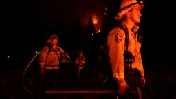 Firefighters are lit by a backfire set to prevent the Caldor Fire from spreading near South Lake Tahoe , Calif., Wednesday, Sept. 1, 2021. 