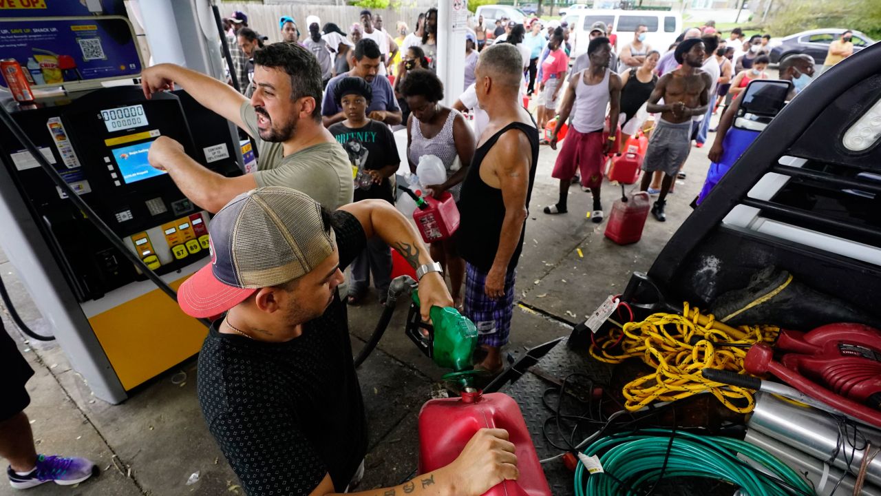 In the aftermath of Hurricane Ida, people wait in line for gas Tuesday.