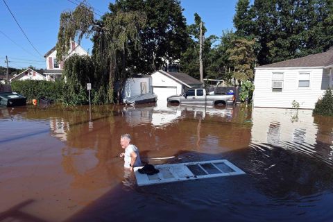 A man wades through floodwaters in Manville, New Jersey, on September 2.