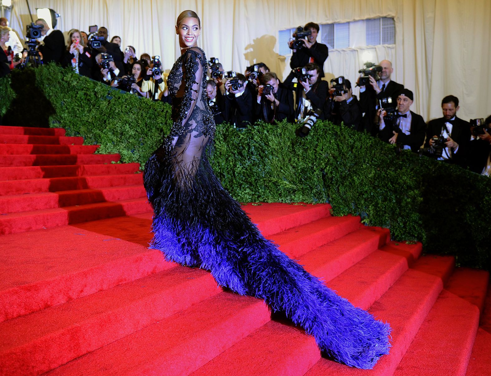 The 2012 Met Gala was a night to remember in part thanks to Beyoncé's dramatic lace haute couture Givenchy gown, complete with an indigo train of ombré feathers.