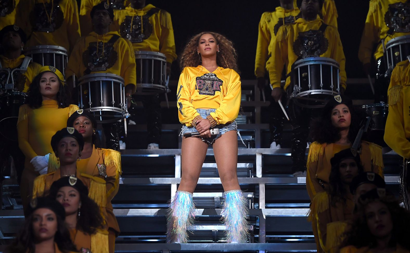 Beyoncé made history in 2018 by being the first Black woman to headline Coachella Music Festival, which fans renamed "Beychella" following her two-hour performance. The singer burned through five custom Balmain outfits during the production, including a Balmain Greek Life hoodie paired with iridescent Louboutin fringed boots.