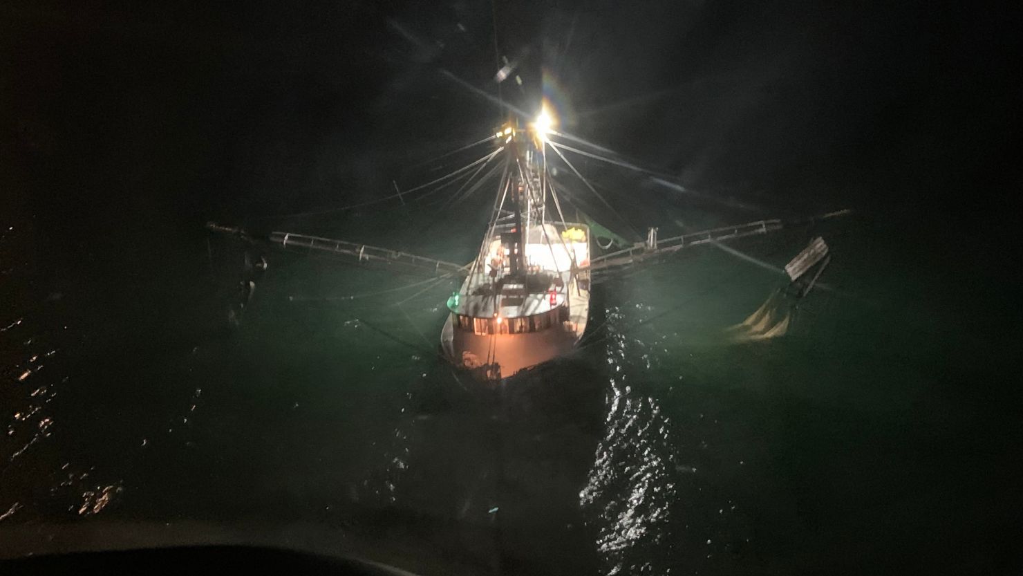 A Coast Guard MH-65 Dolphin helicopter from Air Station New Orleans flew to the fishing vessel Moon Glow after a crew member was attacked by a shark.