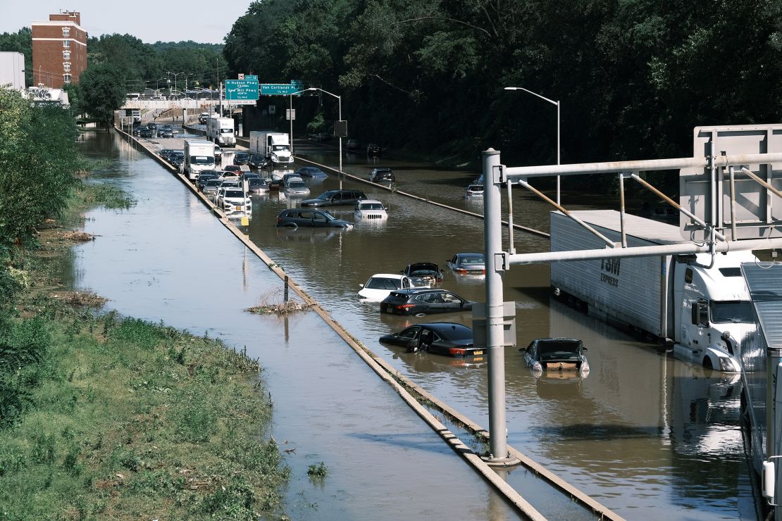 Cars sit abandoned on the flooded Major Deegan Expressway in the Bronx, New York, following a night of heavy wind and rain from the remnants of Hurricane Ida.