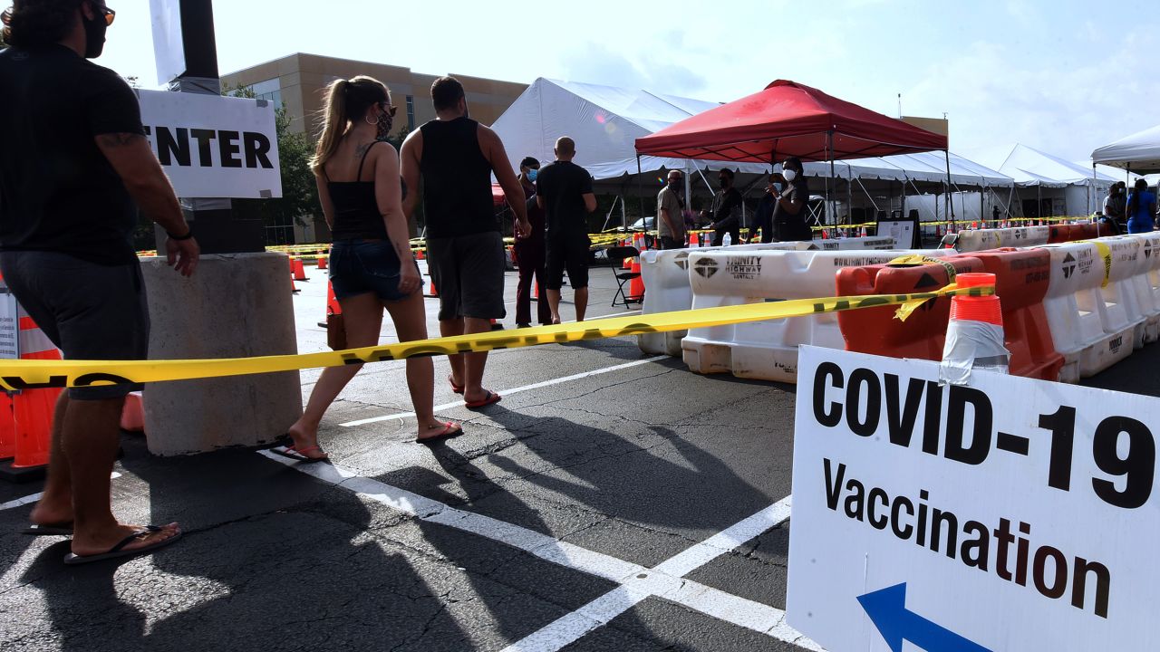 People arrive at the FEMA-supported Covid-19 vaccination site at Valencia State College on the first day the site resumed offering the Johnson & Johnson vaccine following the lifting of the pause ordered by the FDA and the CDC due to blood clot concerns.