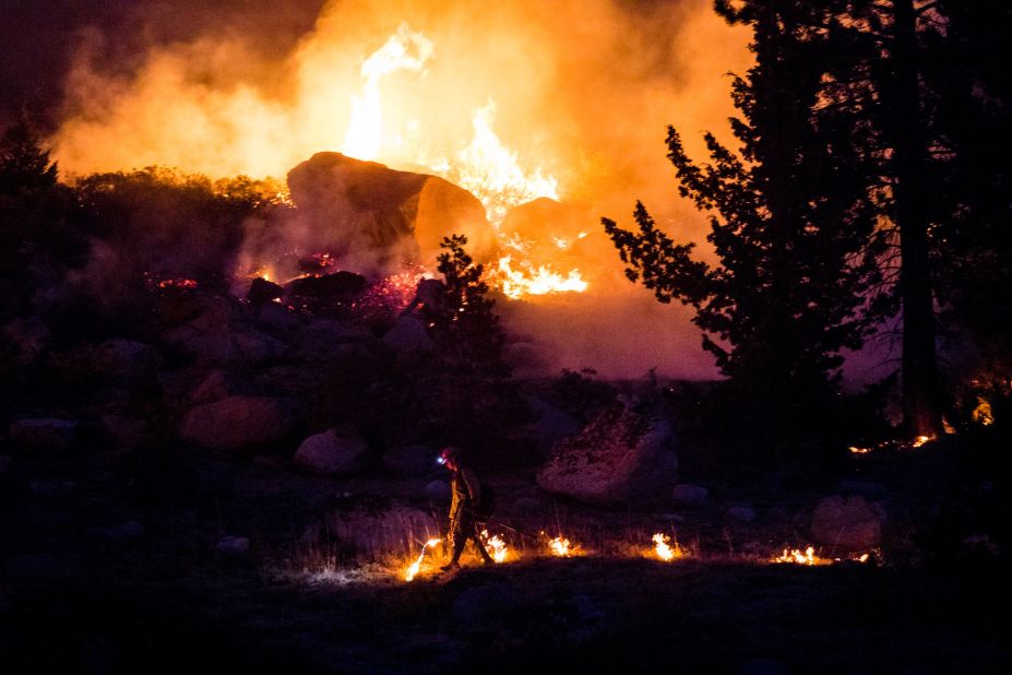 A firefighter is seen as the Caldor Fire rages near California's Silver Lake on September 2.