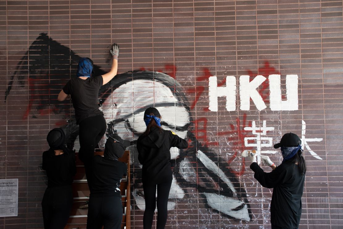 Graffiti on a wall at HKU during the 2019 siege reads "revolution university."