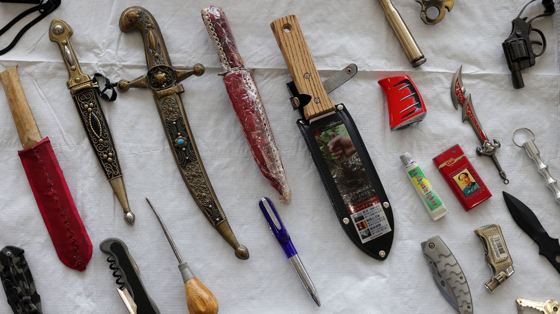 Prohibited items, discovered by the TSA during screening and voluntarily abandoned by travelers, on display at Ronald Reagan Washington National Airport in May 2021. 