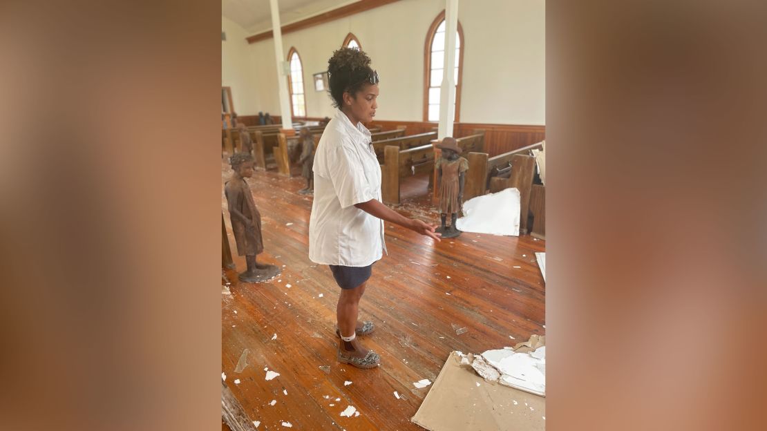 Joy Banner, the communications director at Whitney Plantation and a descendent of enslaved Africans, shows some of the damage to a church that was built by freed slaves on the plantation, which is now a museum.