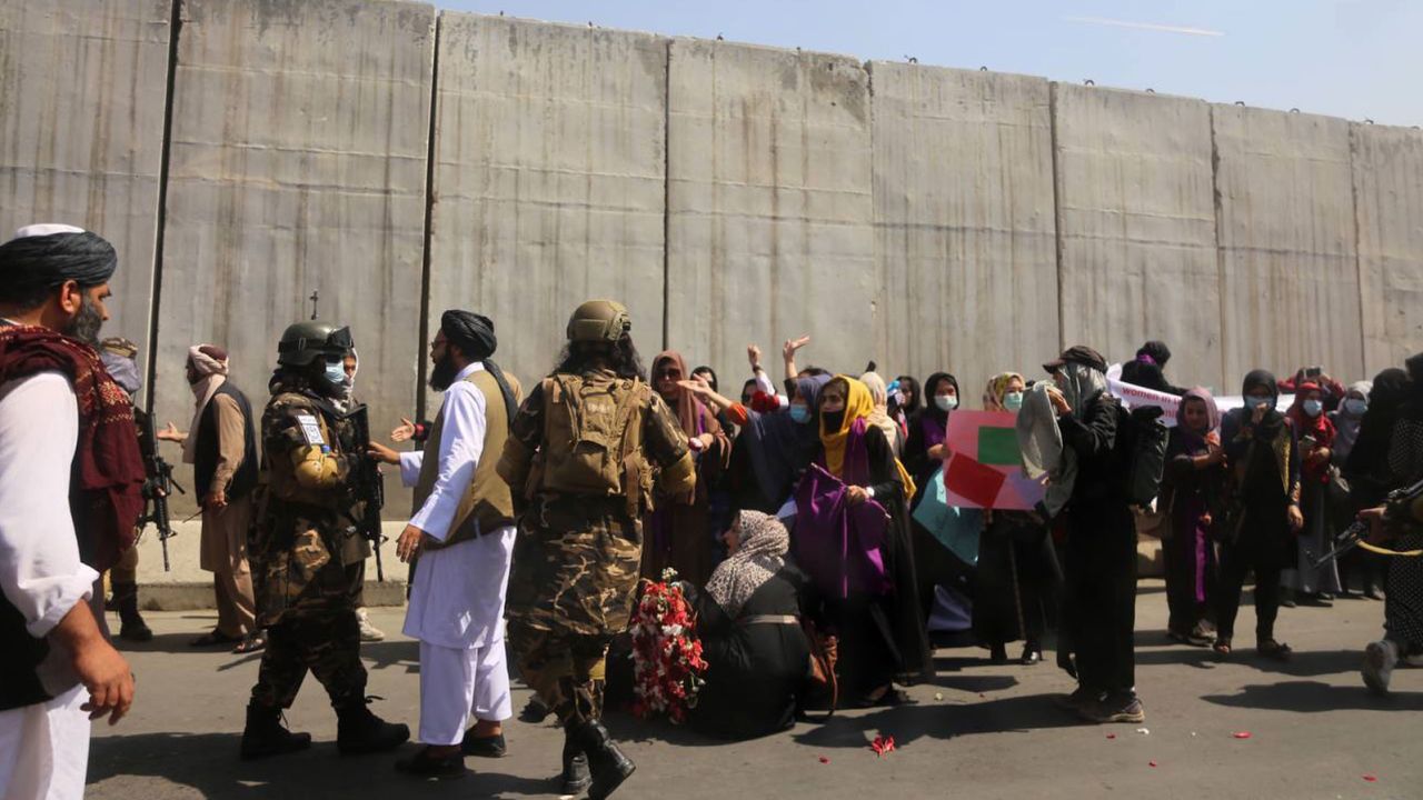 Taliban guards intervene against women holding a demonstration in Kabul on September 4, 2021.