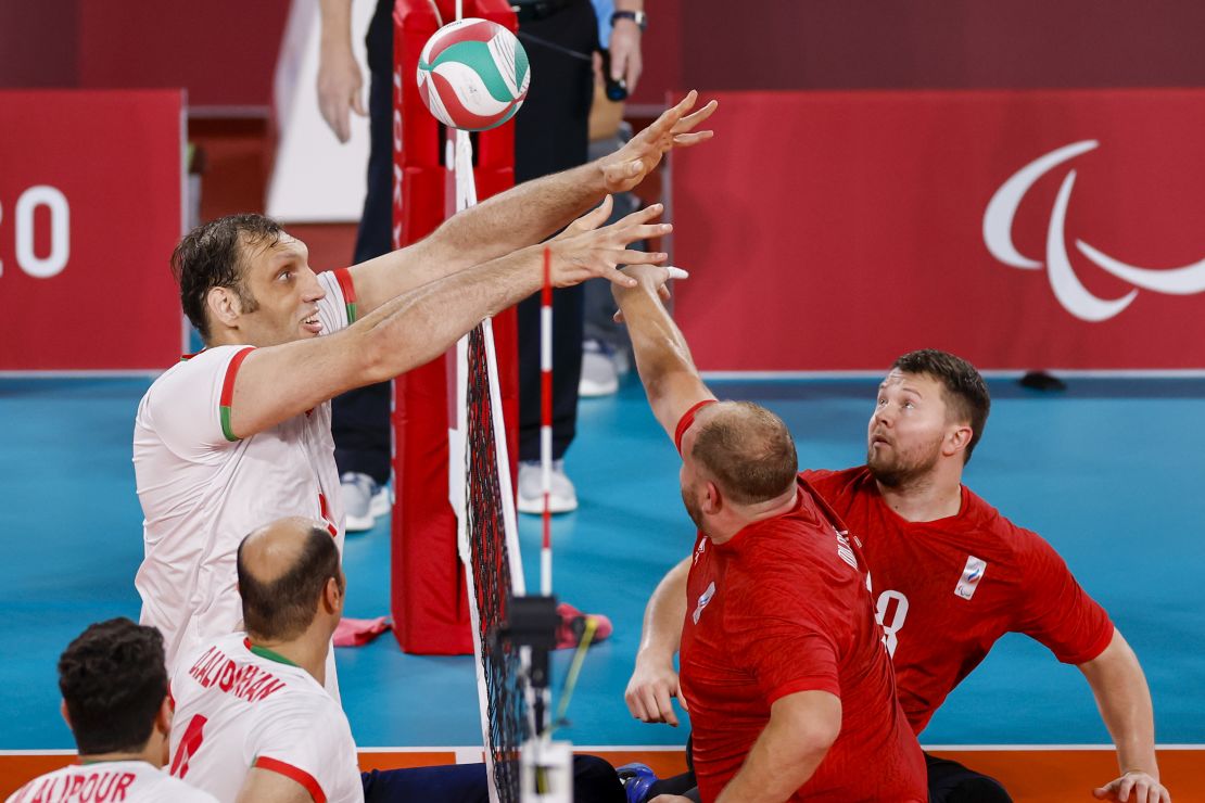 Mehrzad competes at the net against the RPC's Viktor Milenin during the men's sitting volleyball final.