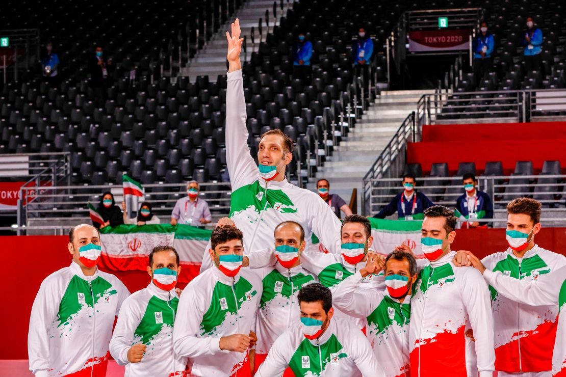 The Iranian team celebrates successfully defending its sitting volleyball title at the Paralympics. 