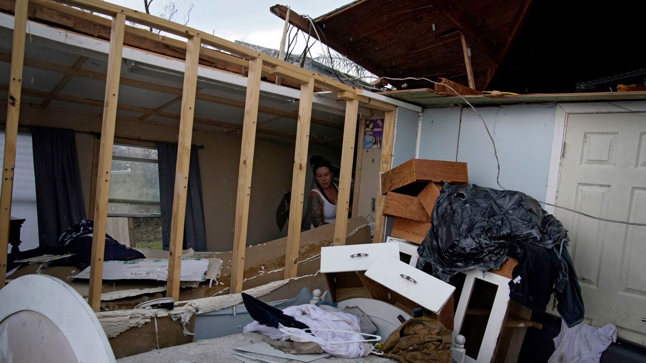 Amber Breaux looks through the remnants of her destroyed home for items to save in the aftermath of Hurricane Ida on Saturday in Dulac, Louisiana.