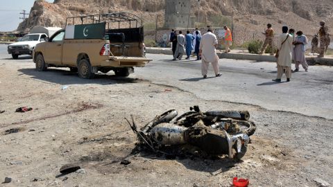 Security officials examine the site of a suicide blast at a checkpoint on the outskirts of Quetta, Pakistan on Sunday.
