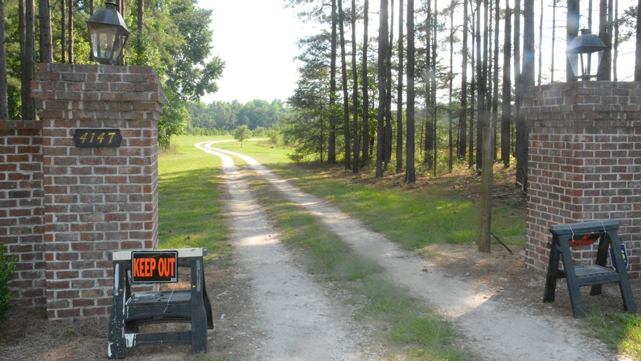 "Keep Out" signs mark an entrance to the Murdaugh family property in Islandton, where authorities say Alex Murdaugh's wife and son were killed in June. 