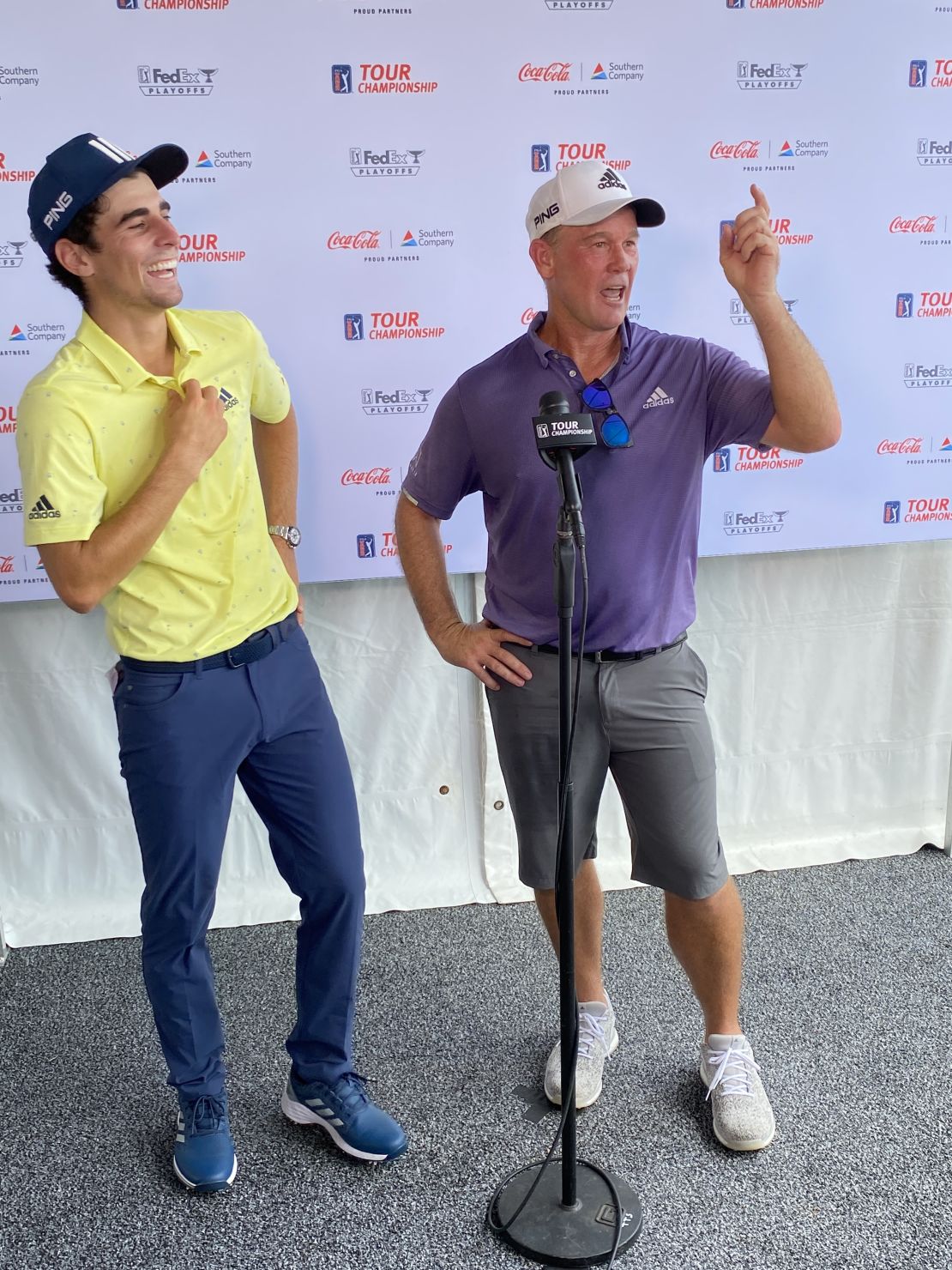 Niemann laughs as his caddie, Gary Matthews, jokes about the crowd's reaction to the record-breaking round.