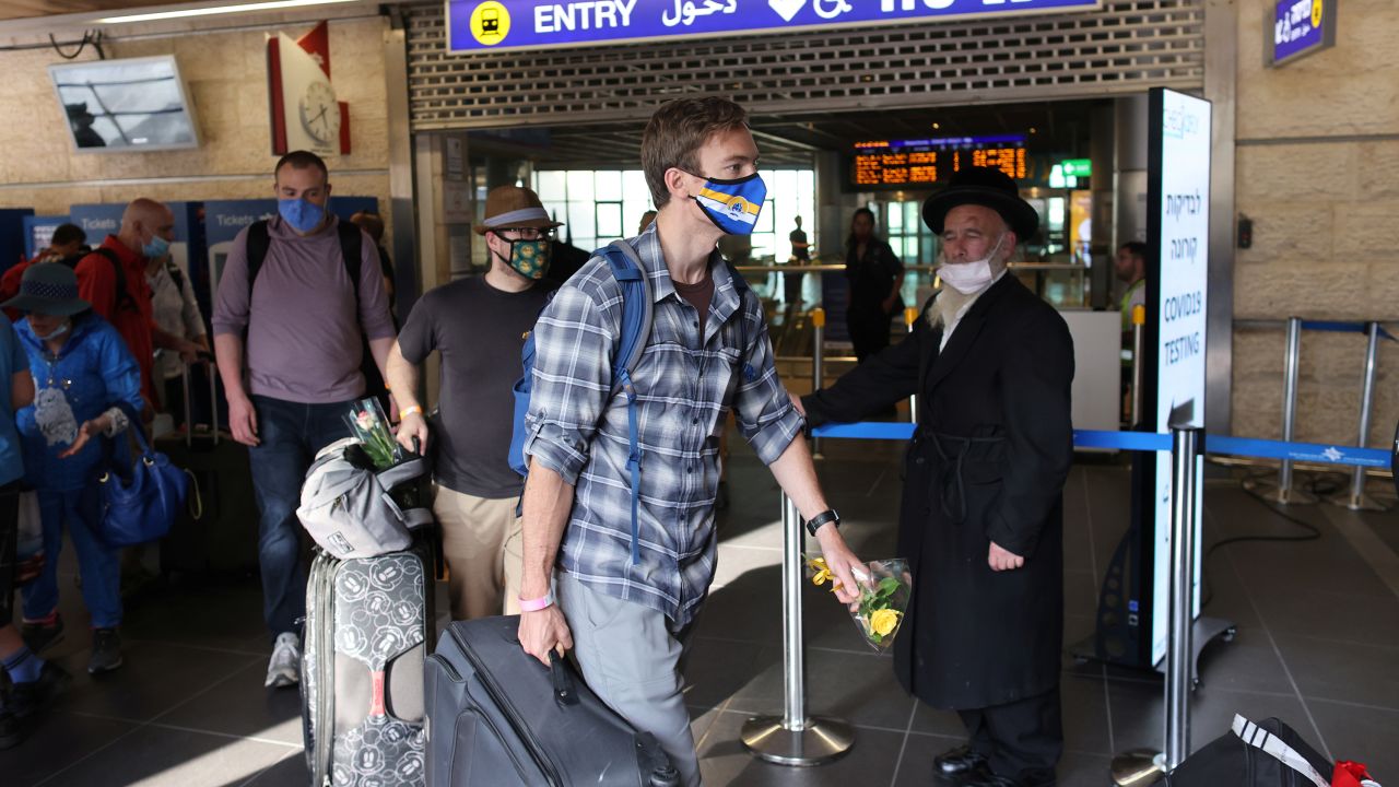 Tourists walk at the Ben Gurion International Airport after entering Israel by plane, as coronavirus disease (COVID-19) restrictions ease, in Lod, near Tel Aviv, Israel, May 27, 2021.