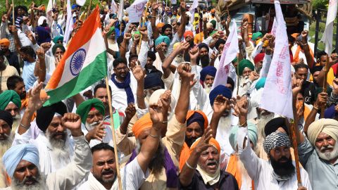 Farmers shout slogans in protest against the  government's agricultural reforms, which they say will ruin their livelihood. 
