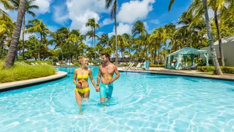 Use Amex's transfer bonus to redeem enough Hilton points for five nights at the Hilton Aruba Caribbean Resort and Casino hotel.