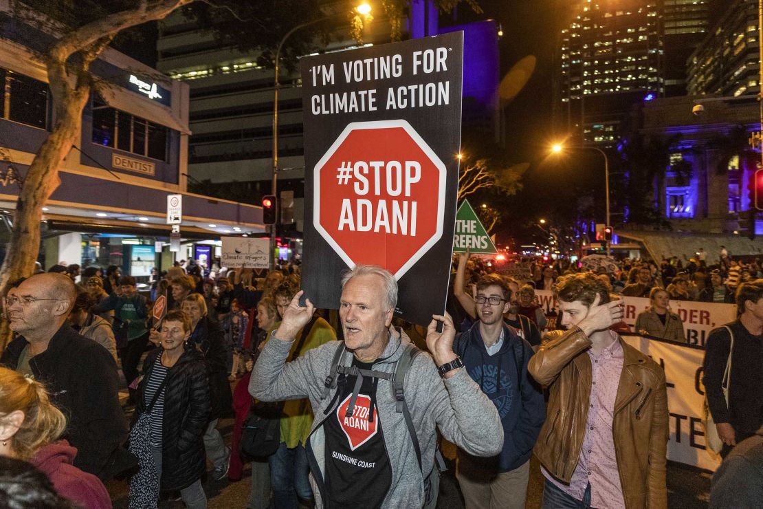 Protesters against the Adani coal mine, now named Bravus, march through the streets of Brisbane on July 5, 2019.