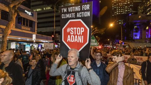 Protesters against the Adani coal mine, now named Bravus, march through the streets of Brisbane on July 5, 2019.