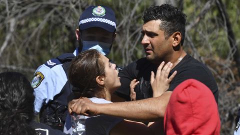 AJ's parents embrace after hearing their son had been found alive.