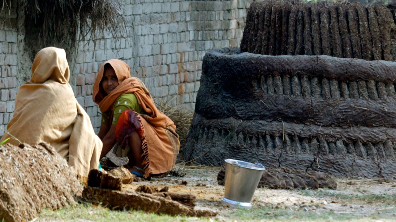 Dalit women work with cow dung on the outskirts of Lucknow in 2008.