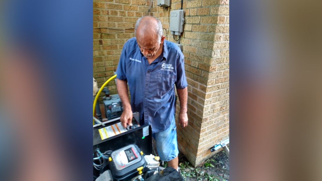 Wayne Encalarde installs a generator onto his home after Hurricane Ida to get his home based business up and running. 