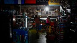 Shoppers buy supplies at a grocery store during the blackout after Hurricane Ida in New Orleans, Louisiana, U.S., on Thursday, Sept. 2, 2021. 