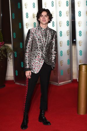 More streetwear details on display at the 2019 British Academy Film Awards dinner, where Chalamet wore a Haider Ackermann look featuring black trousers brought to life with a red checkered racing stripe.