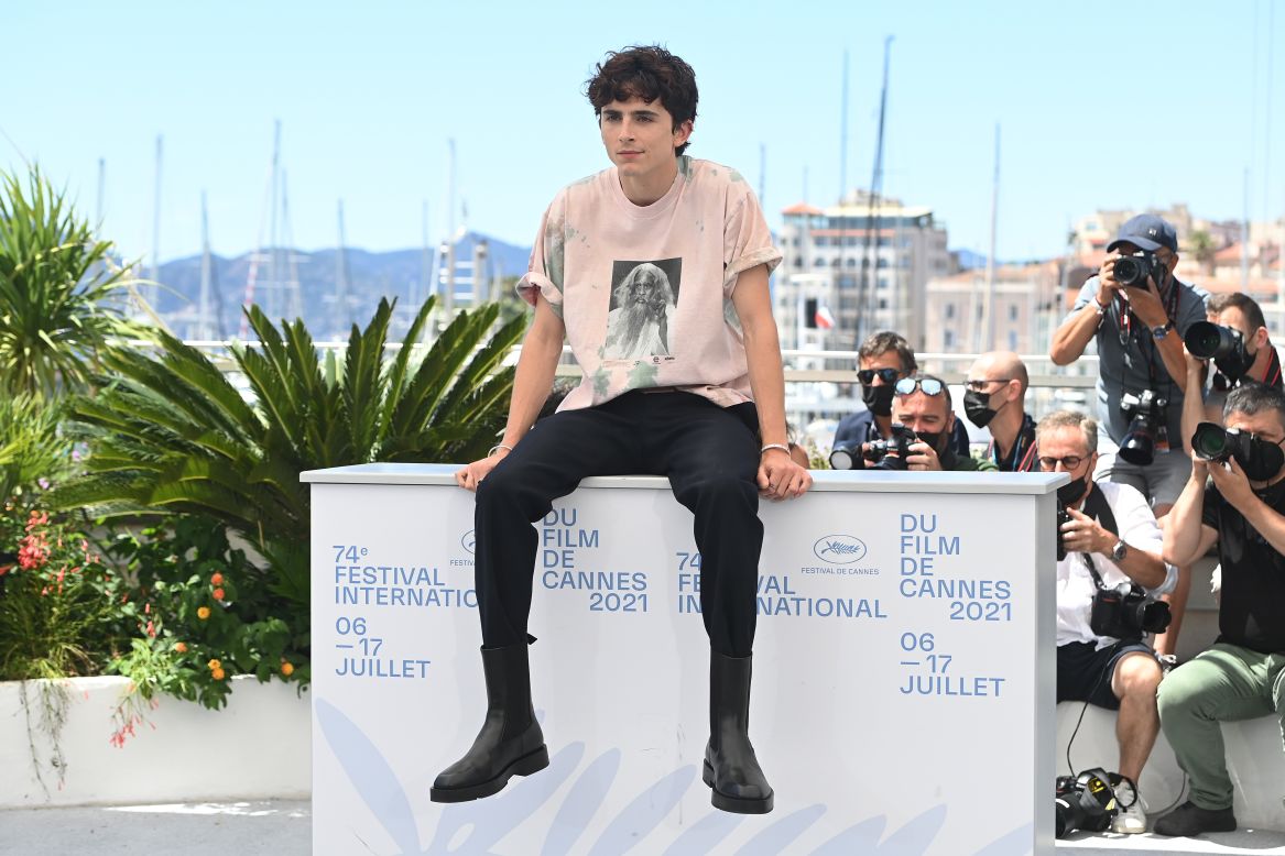 Chalamet pulled off a dressed-down look at a 2021 Cannes event, wearing an Elara T-shirt, black trousers and Givenchy boots. 