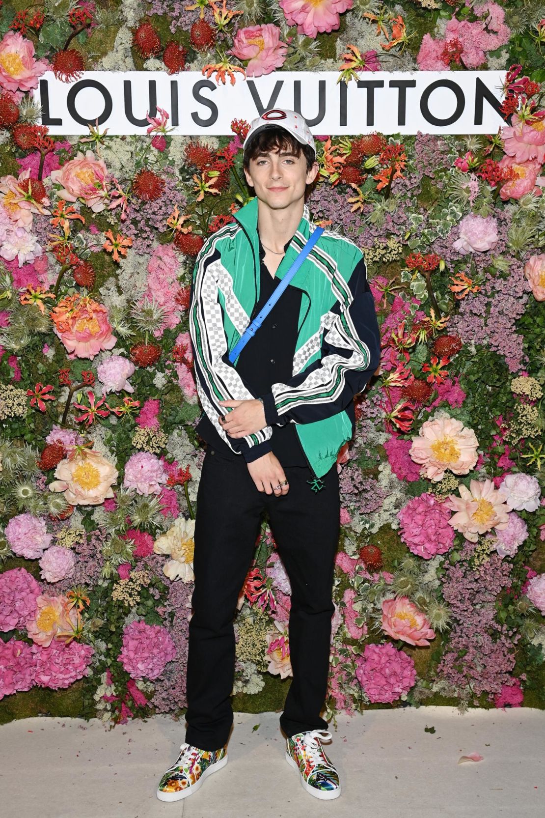 Chalamet wearing a Louis Vuitton athletic jacket to a dinner hosted by the label.