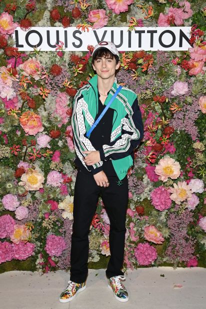He continues to push the boundaries of smart casual attire, seen here wearing a Louis Vuitton shell jacket to a 2021 Cannes dinner hosted by the label. 