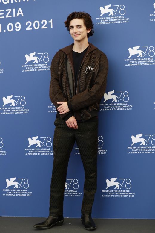 Yet Chalamet never strays too far from his friend Haider Ackermann  pairing one of the designer's tracksuits with two vintage Cartier brooches at a photocall for his 2021 movie, "Dune."