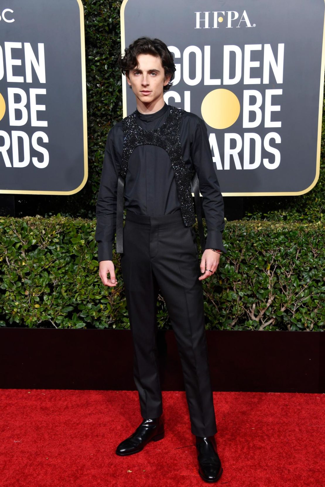 Social media exploded when Chalamet wore this black glittering Louis Vuitton harness to the Golden Globes.