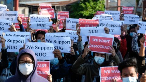 Protesters hold posters in support of the National Unity Government (NUG) during a demonstration against the military coup in Taunggyi, Shan state on May 2.