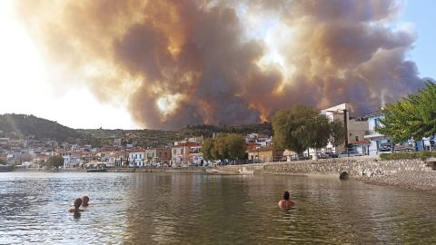 Flames burn on a mountain near the Greek village of Limni, on the island of Evia about 100 miles north of Athens, on August 3.