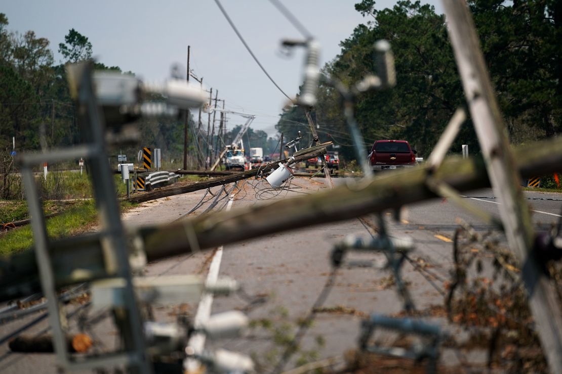 Downed utility poles lie on a road in Albany, Louisiana, on September 2.