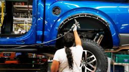 A UAW worker assembles a 2018 Ford F-150 truck at the Ford Rouge assembly plant, in Dearborn, Mich., on Sept. 27, 2018. The Dearborn plant will assemble the all-electric Ford F150 Lightning, which will be available next year. 